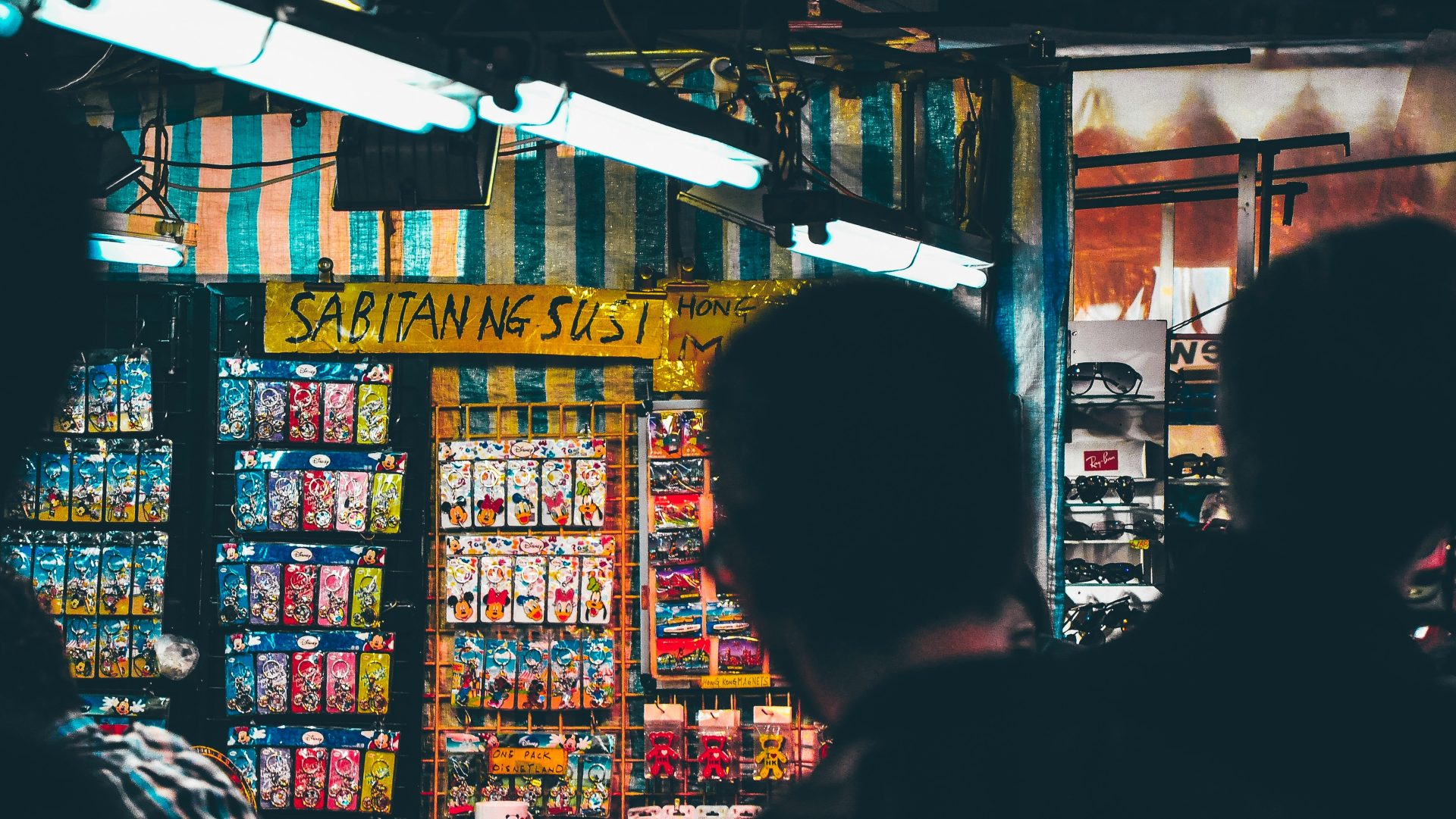 a group of people standing in front of a store